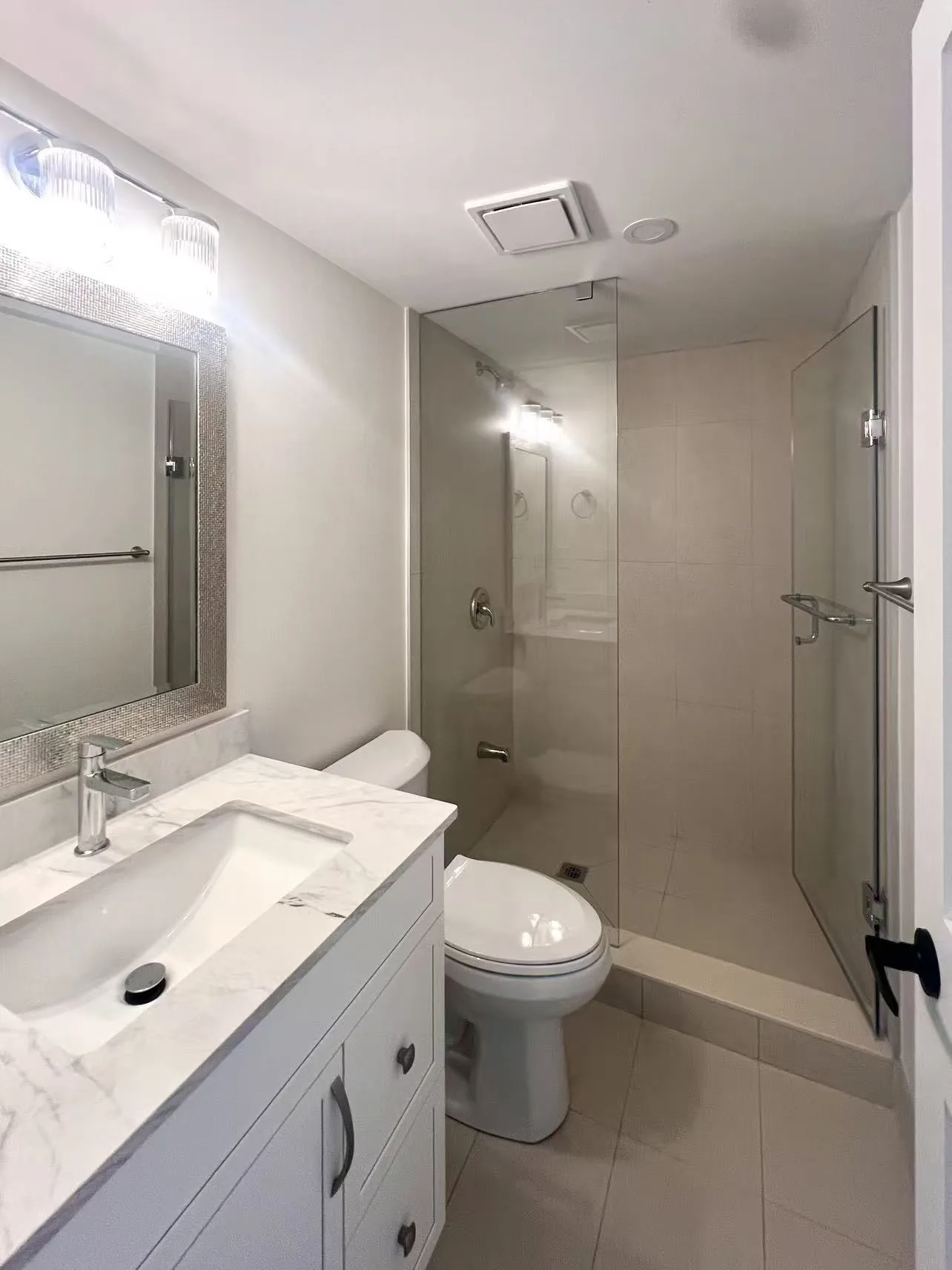 Bathroom vanity and glass shower